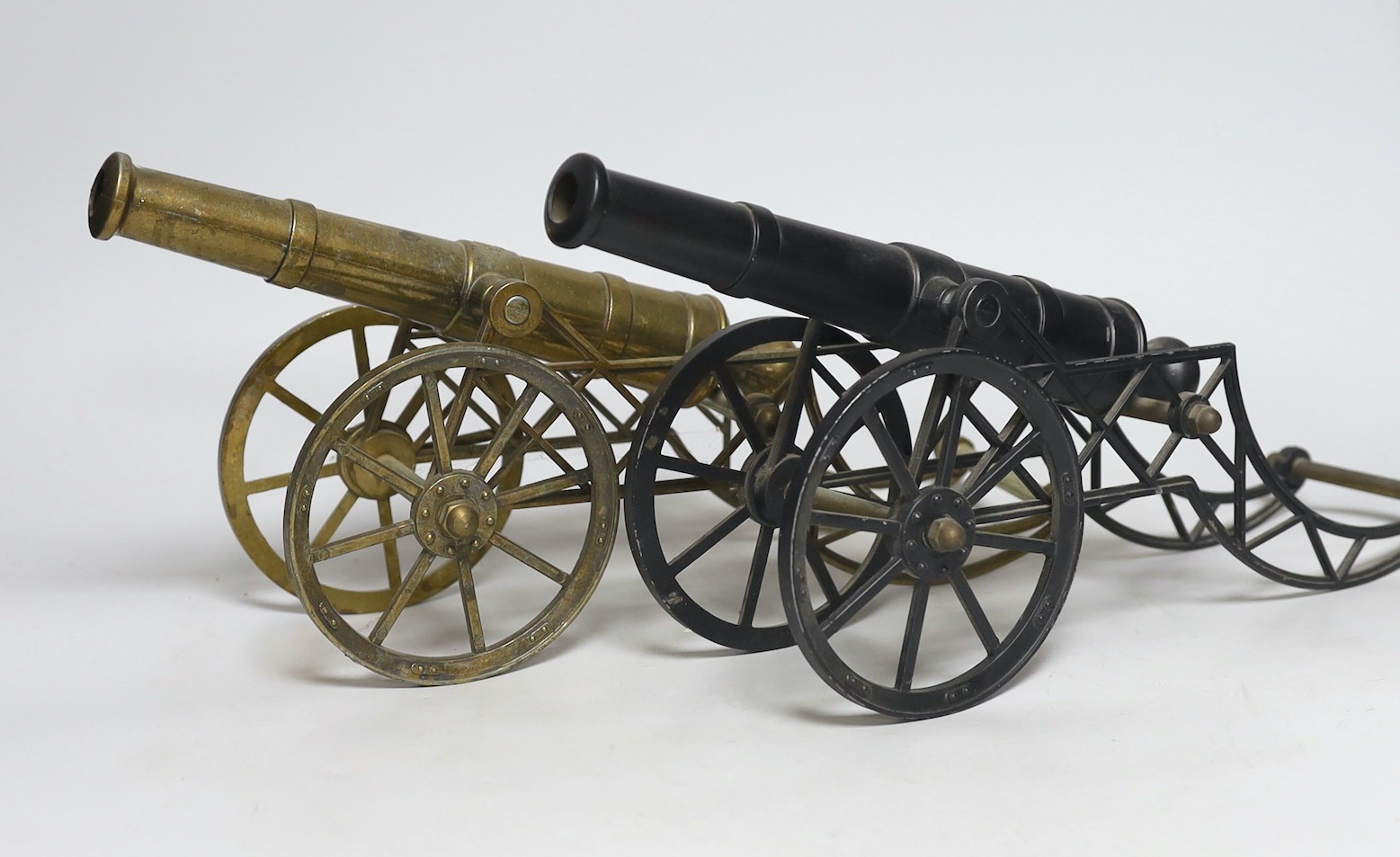 Two models of cannons, stamped G.A.A.D., 40cm long